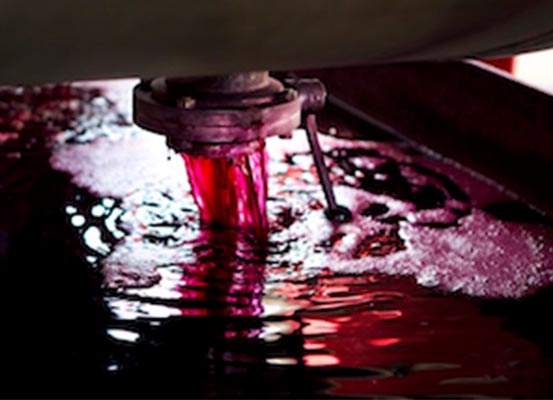 Grape juice dripping out of container